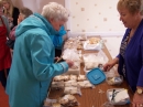 Helena making a purchase at the cake & candy stall from Elizabeth