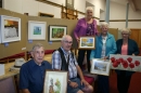 Art group members with their work on display